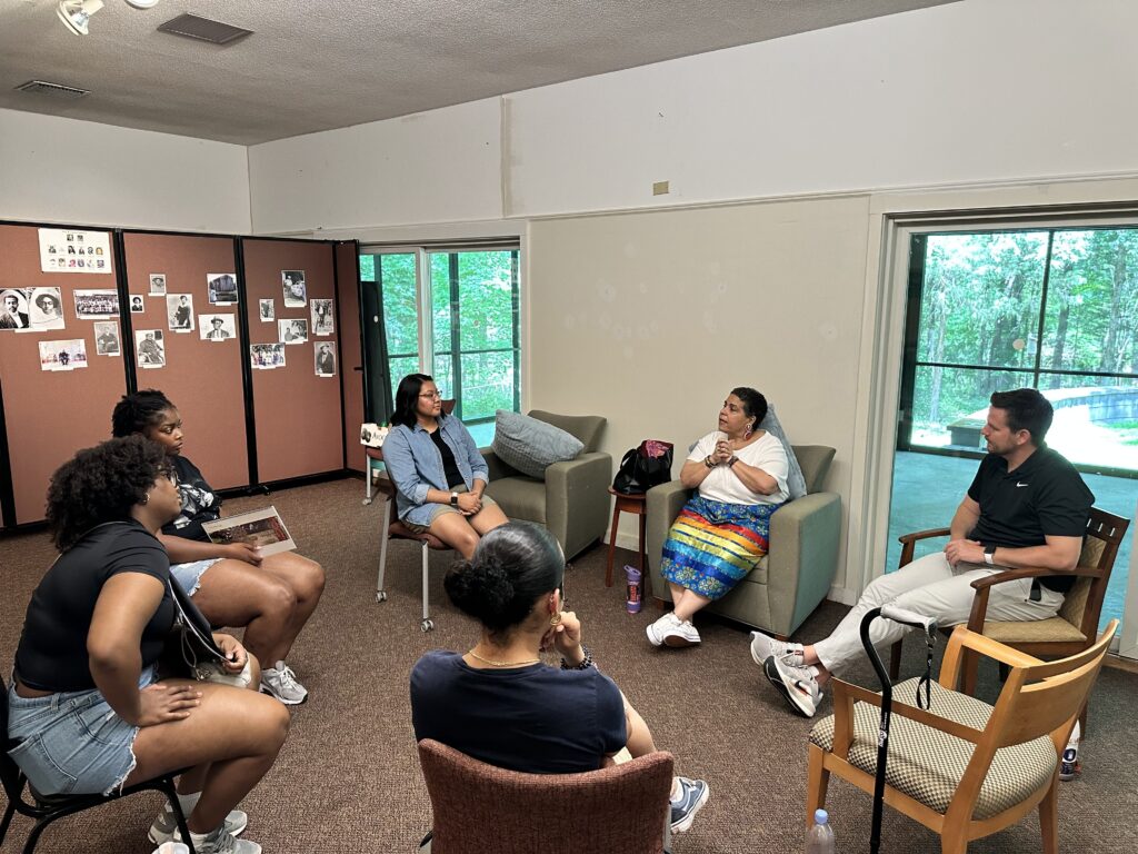 Duke and NCCU students listening to Ms. Vivette Jeffries of the Occaneechi Band of the Saponi Nation at Stagville Historic Site during the Durham Interfaith Pilgrimage of Pain and Hope.